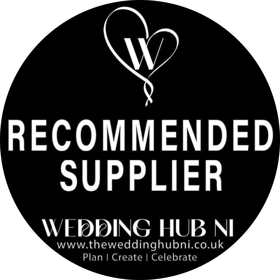 Black and white circular logo for Wedding Hub NI Recommended Supplier with heart balloon design.