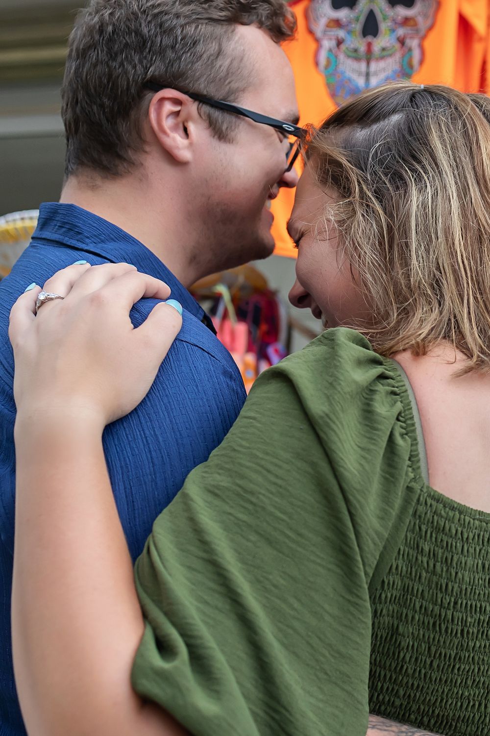 A sequential series of close-up shots showing a couple in blue and green clothing sharing an intimate moment.