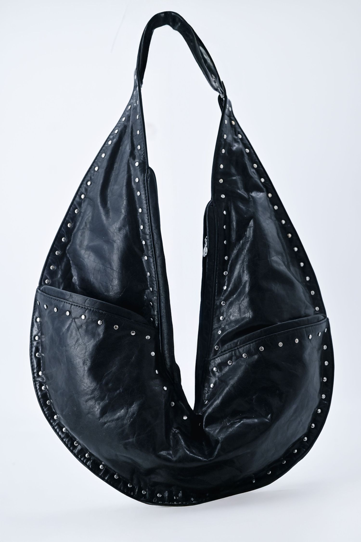 Multiple views of a black leather hobo bag with silver studded details against white background.