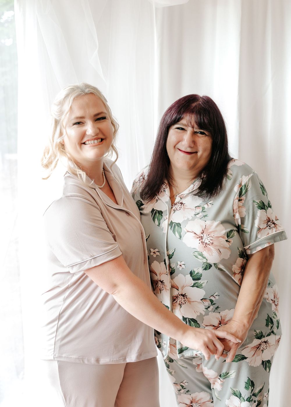 Natural candid portraits capture genuine laughter and connection between two people in complementary outfits.