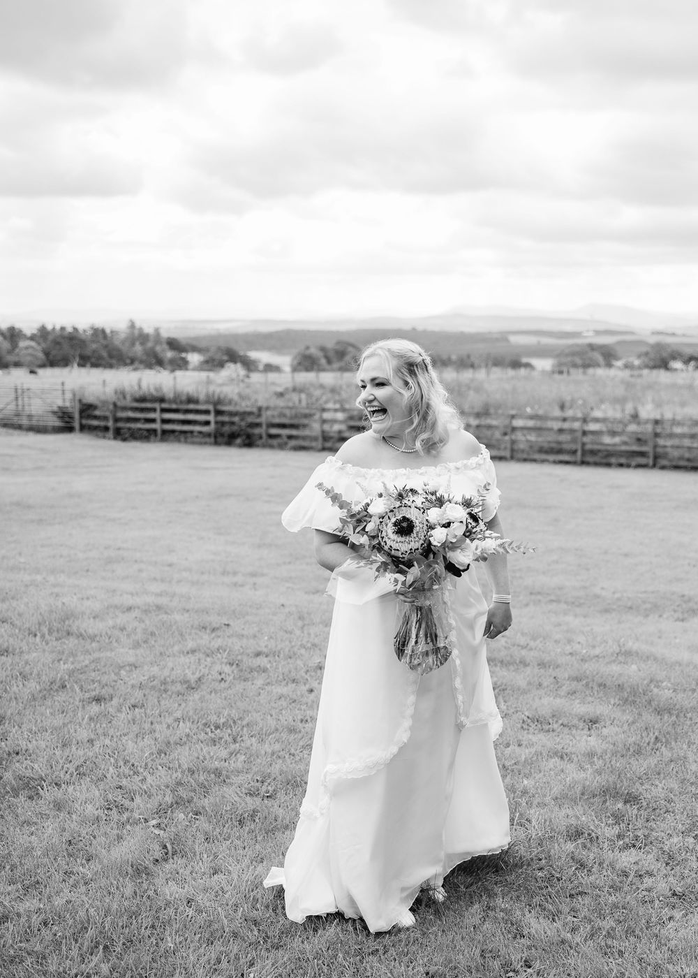 Black and white photos show person in white dress holding flowers while walking through a field.