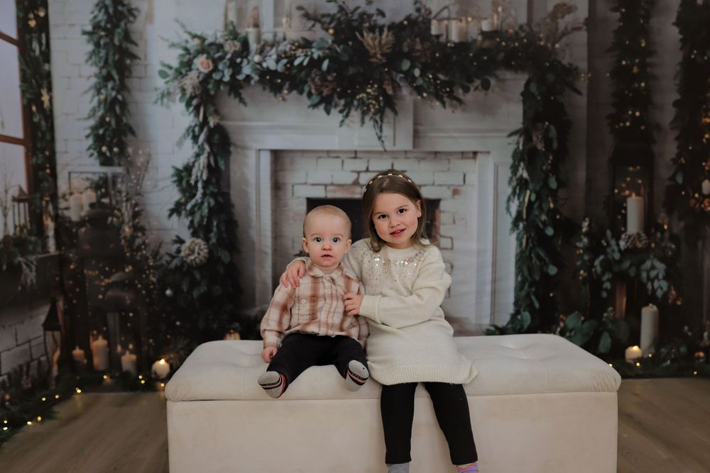 Intimate family portrait session with holiday decorations and warm ambient lighting.