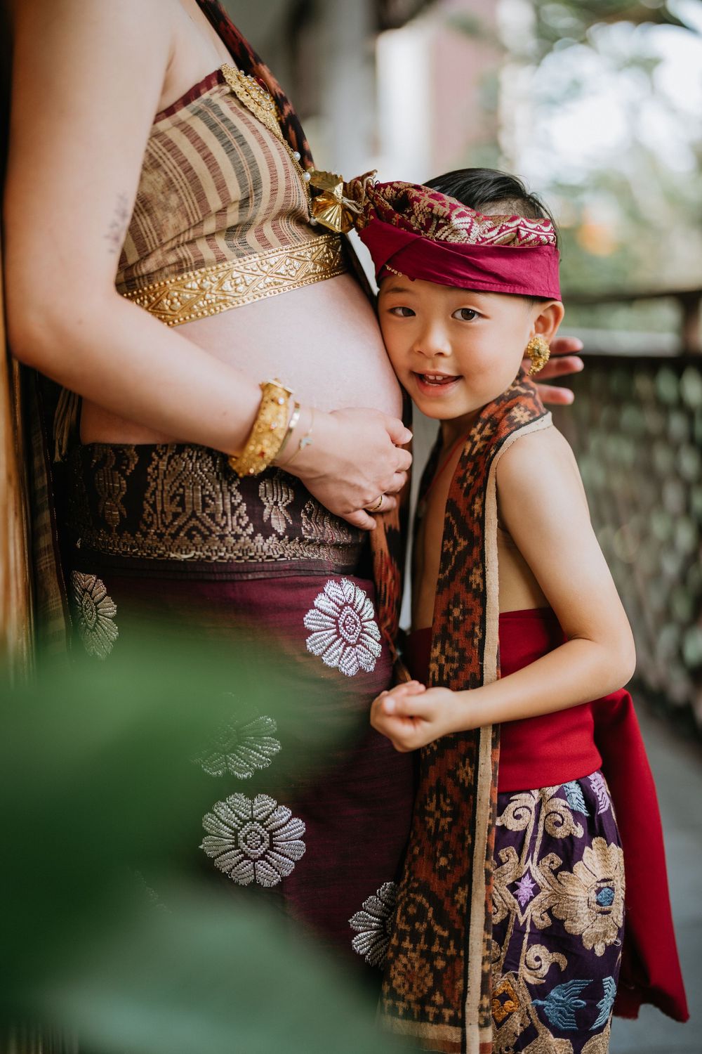 Close-up details of ornate traditional Balinese clothing and accessories.