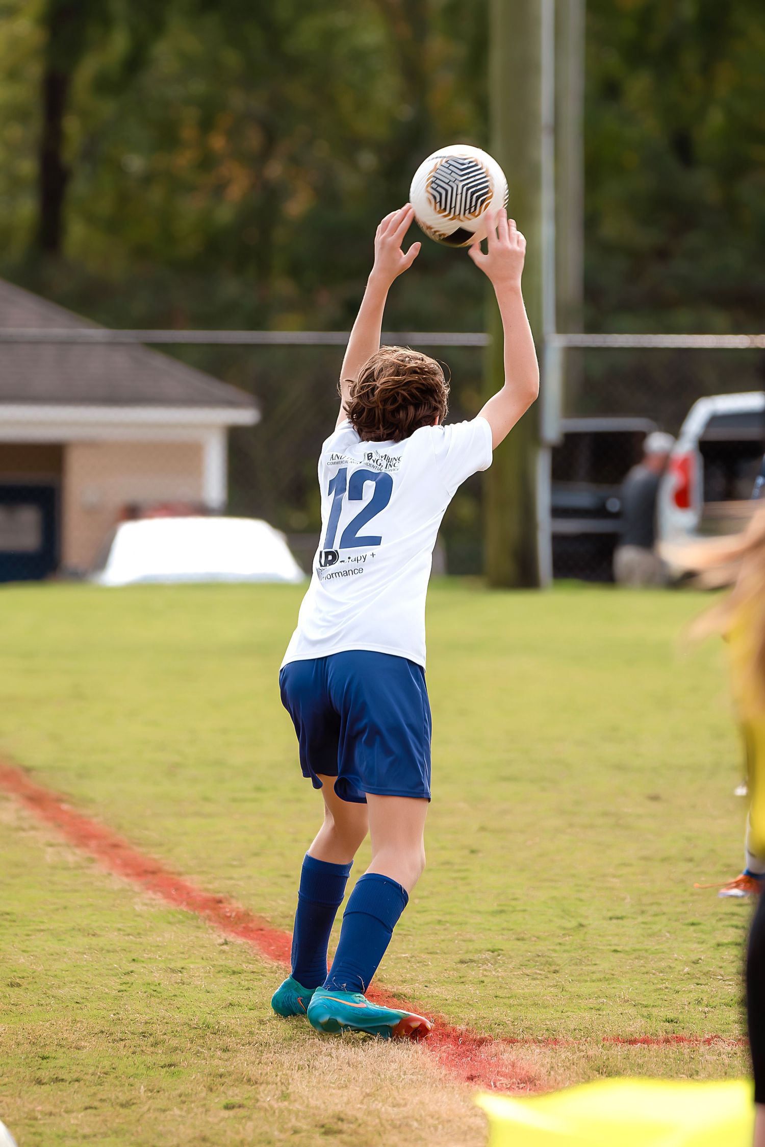 A sequence of photos showing a youth soccer player diving to make a dramatic save on the field.