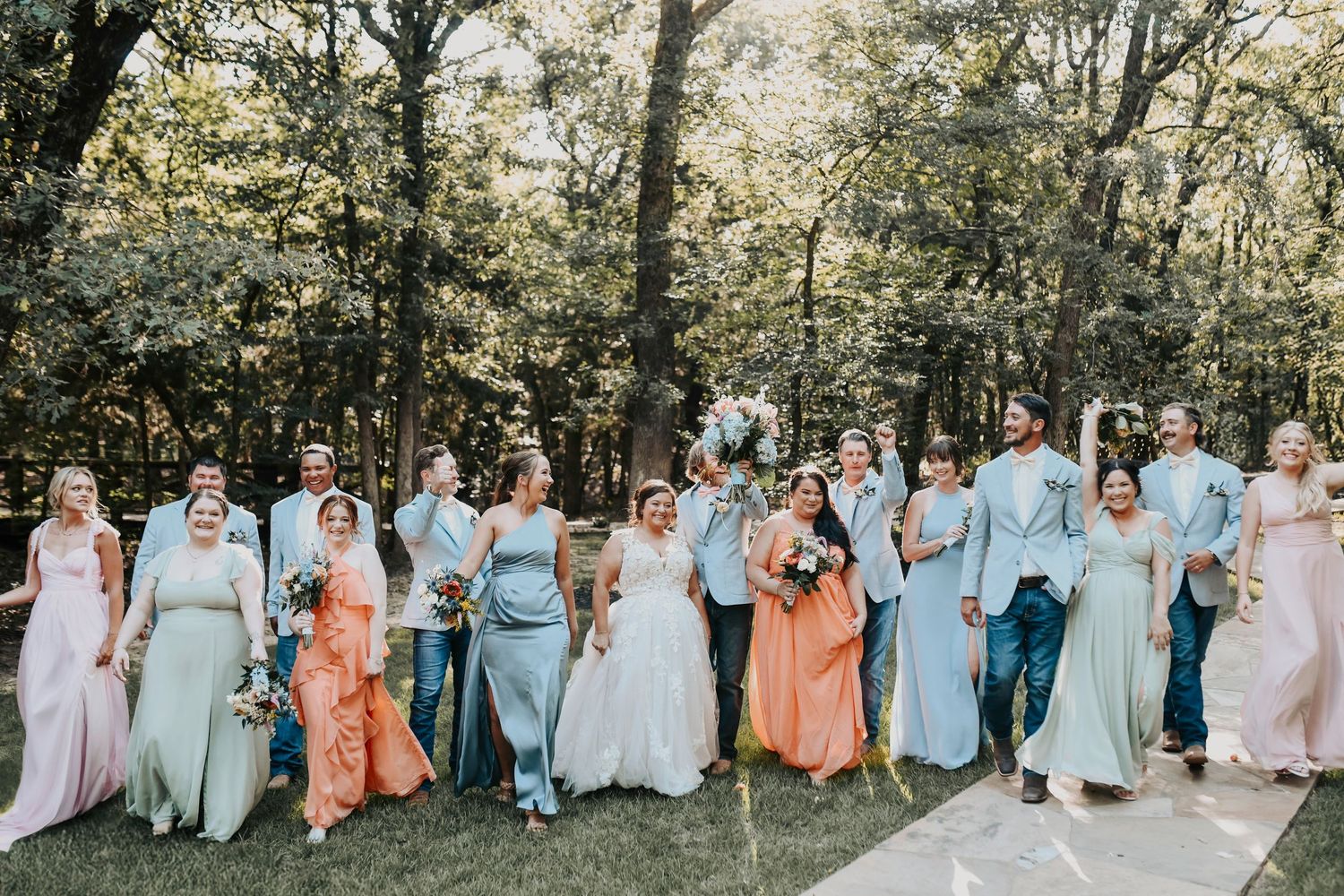 Groomsmen and bridesmaids with couple at Whispering Oaks