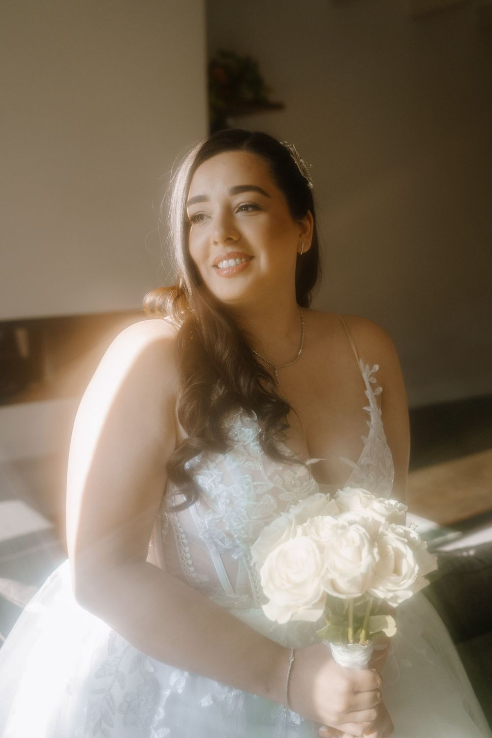 A series of dreamy bridal portraits showing someone in a white lace wedding dress holding a bouquet in soft lighting.
