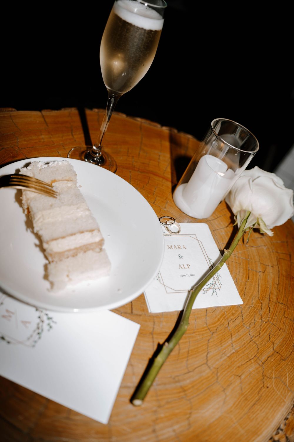 A sequence of four photos showing champagne glasses and cake slices on a wooden table with a single white flower.
