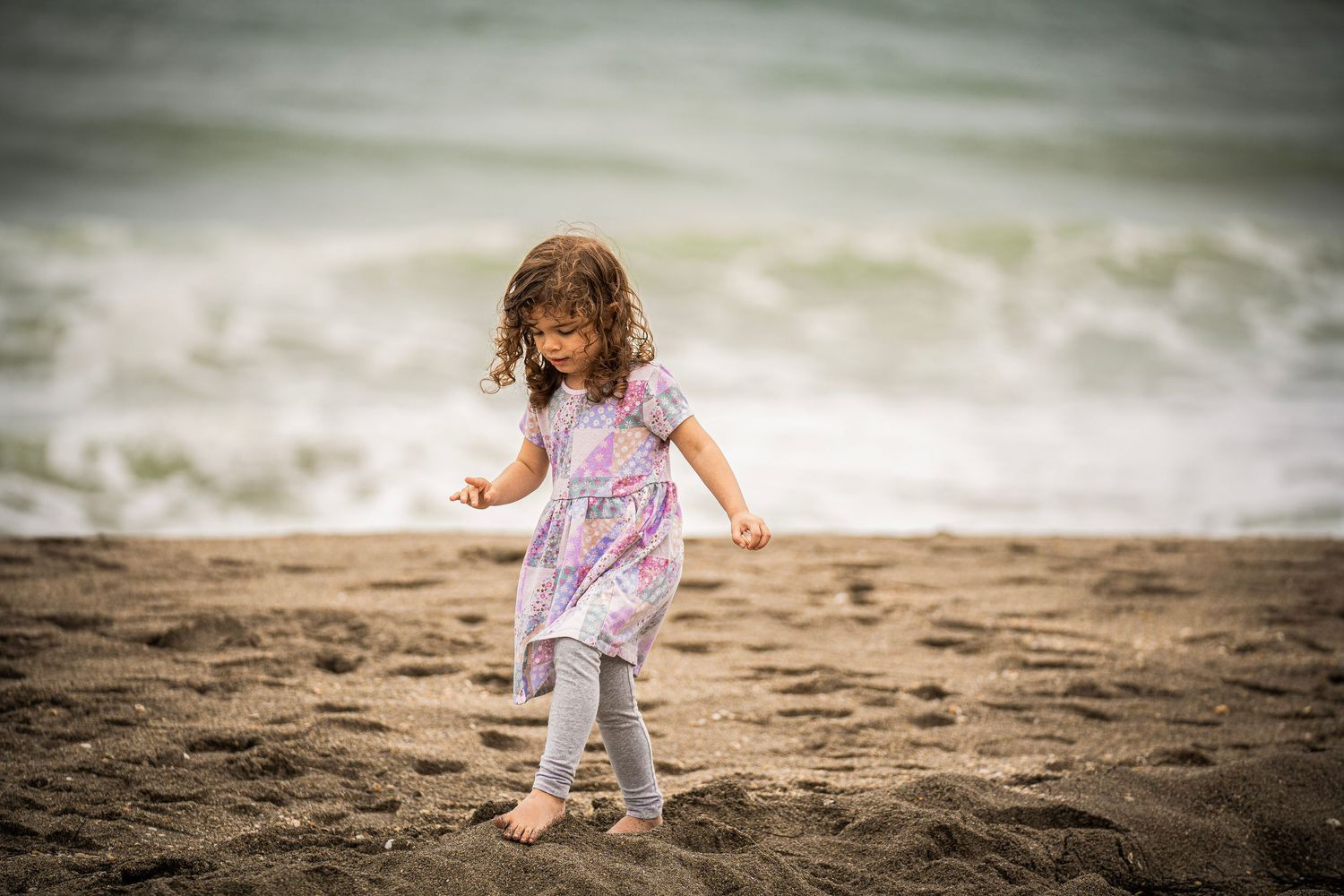 My adorable niece, Evelyn, on Jupiter Beach, looking at the camera.