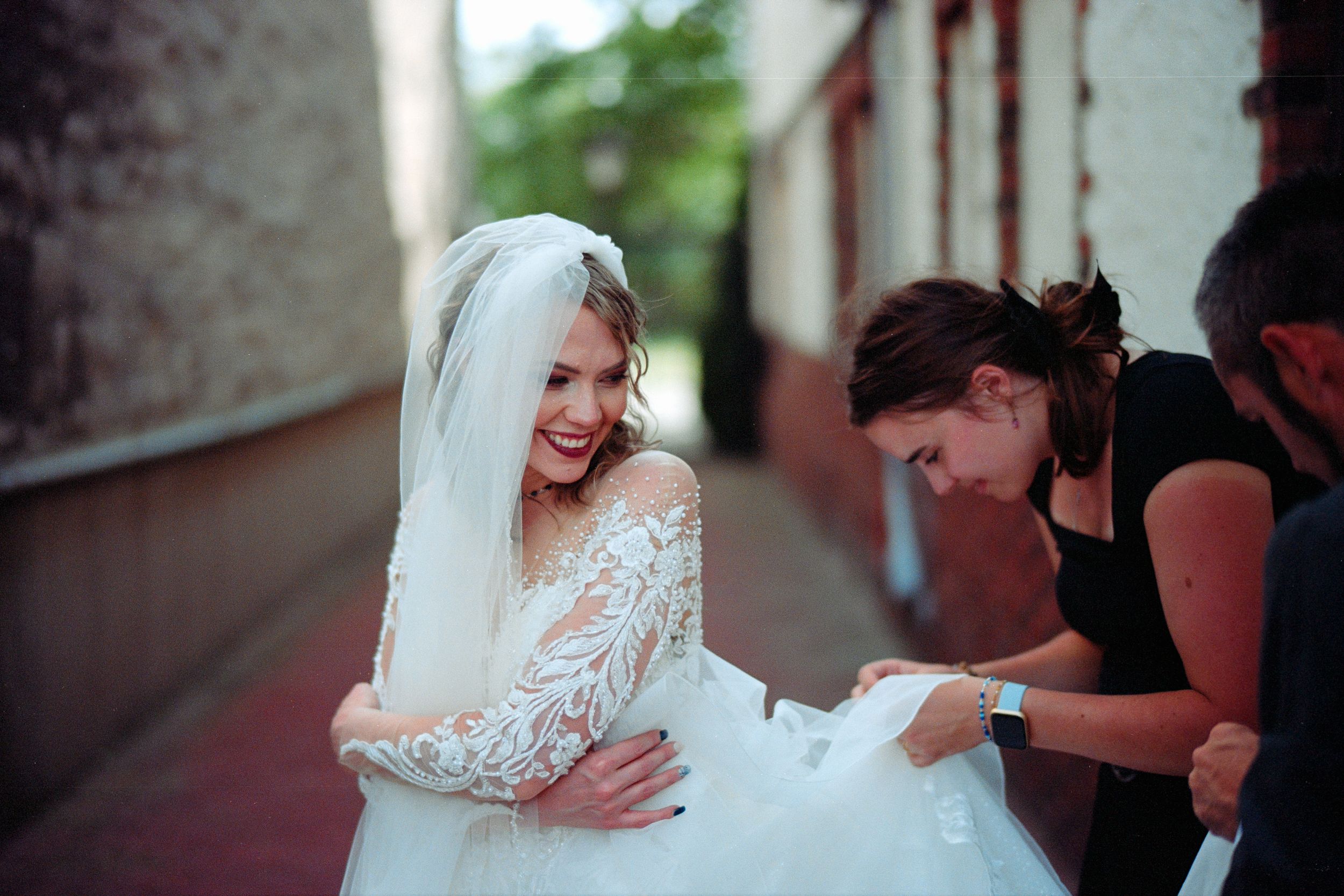 Two people embrace during an emotional moment at a wedding ceremony.