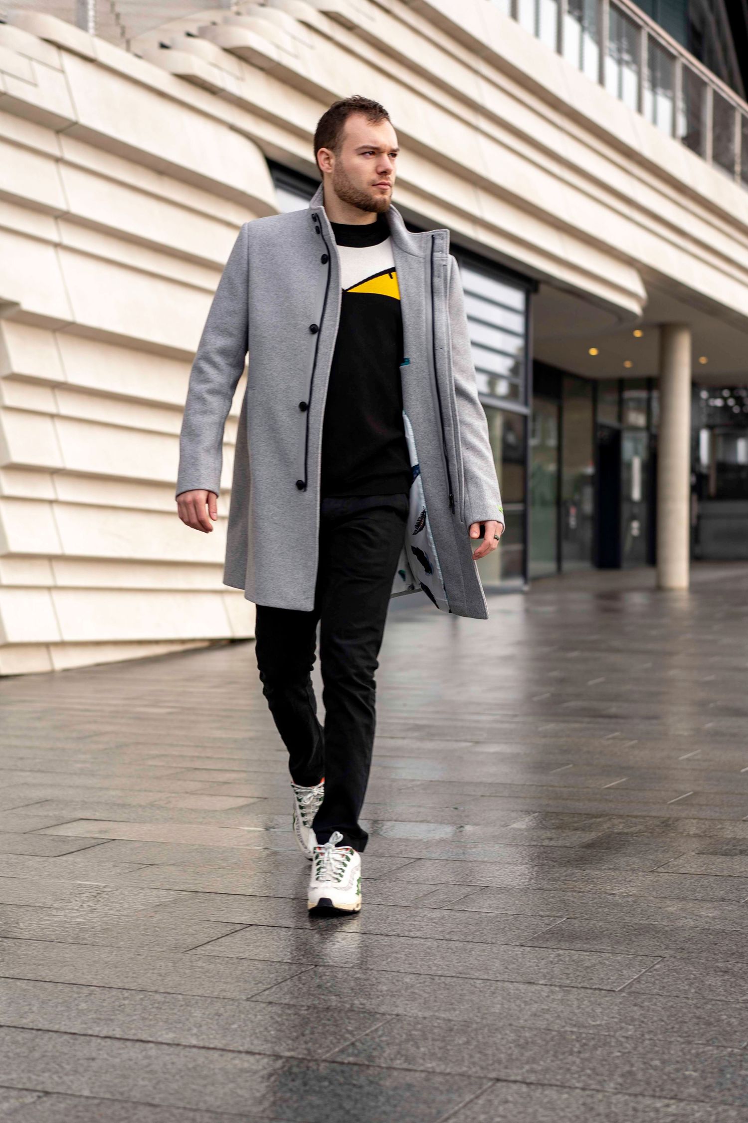 Young entrepreneur walks through the Southampton streets with confidence on a personal branding photoshoot in Hampshire.