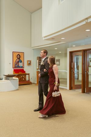A sequence of photos shows movement through an indoor venue hallway with carpeted floors and recessed lighting.