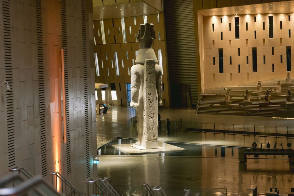 Interior view of a modern church sanctuary with dramatic architectural lighting and geometric wall patterns.
