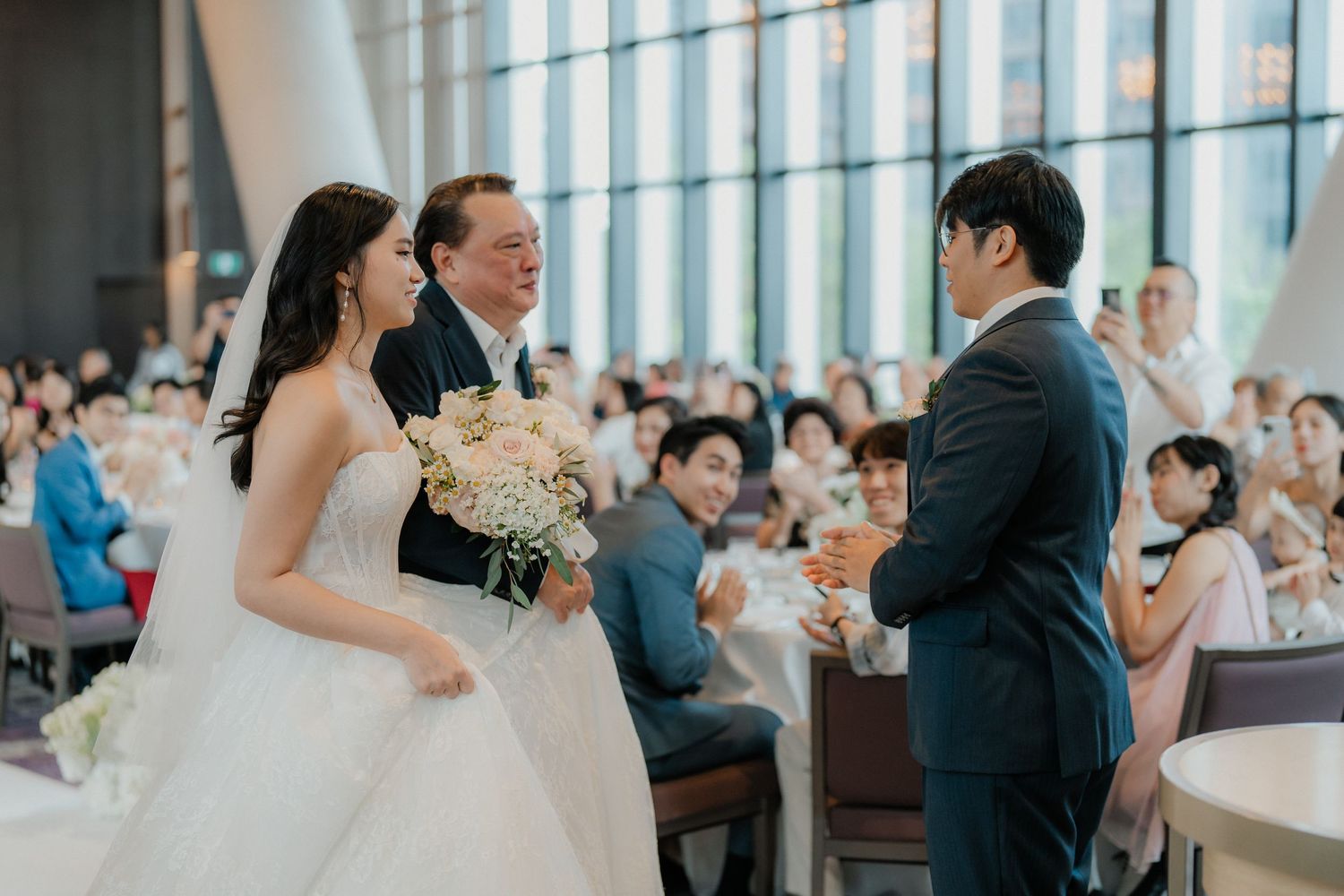 Wedding ceremony in progress with the couple and officiant standing at the altar.