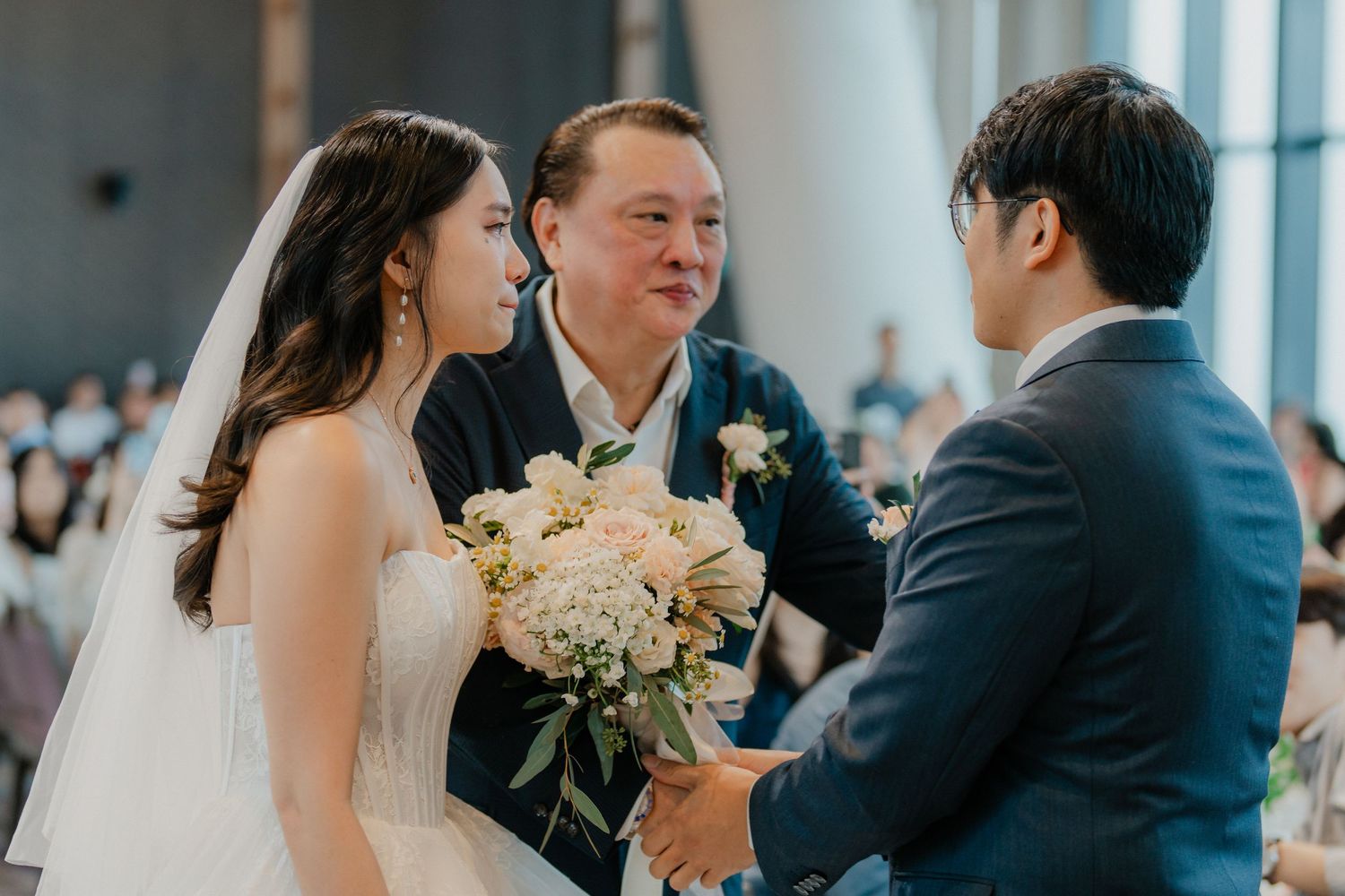 Emotional wedding ceremony moment as couple exchanges vows with the officiant.