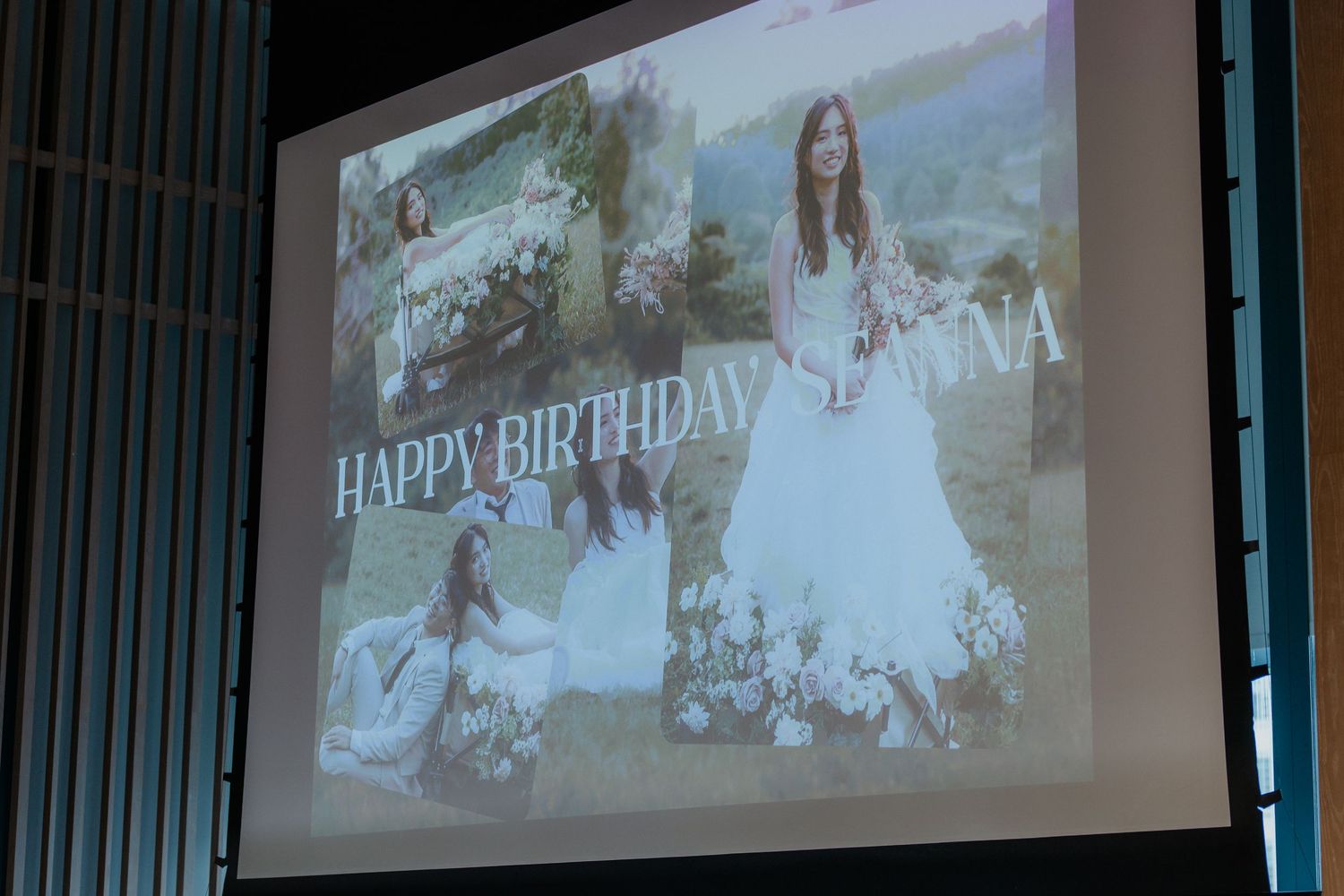 Wedding slideshow projected on large screen during reception showing outdoor photographs.