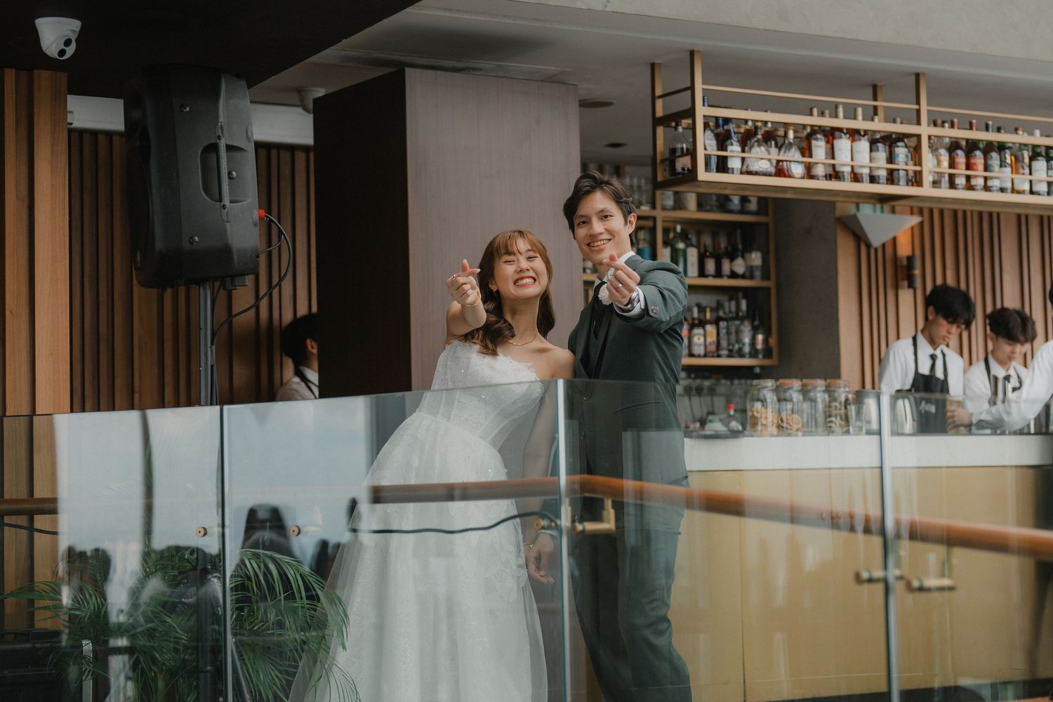 Modern venue interior with glass windows and wood accents showcasing an elegant wedding reception setup.