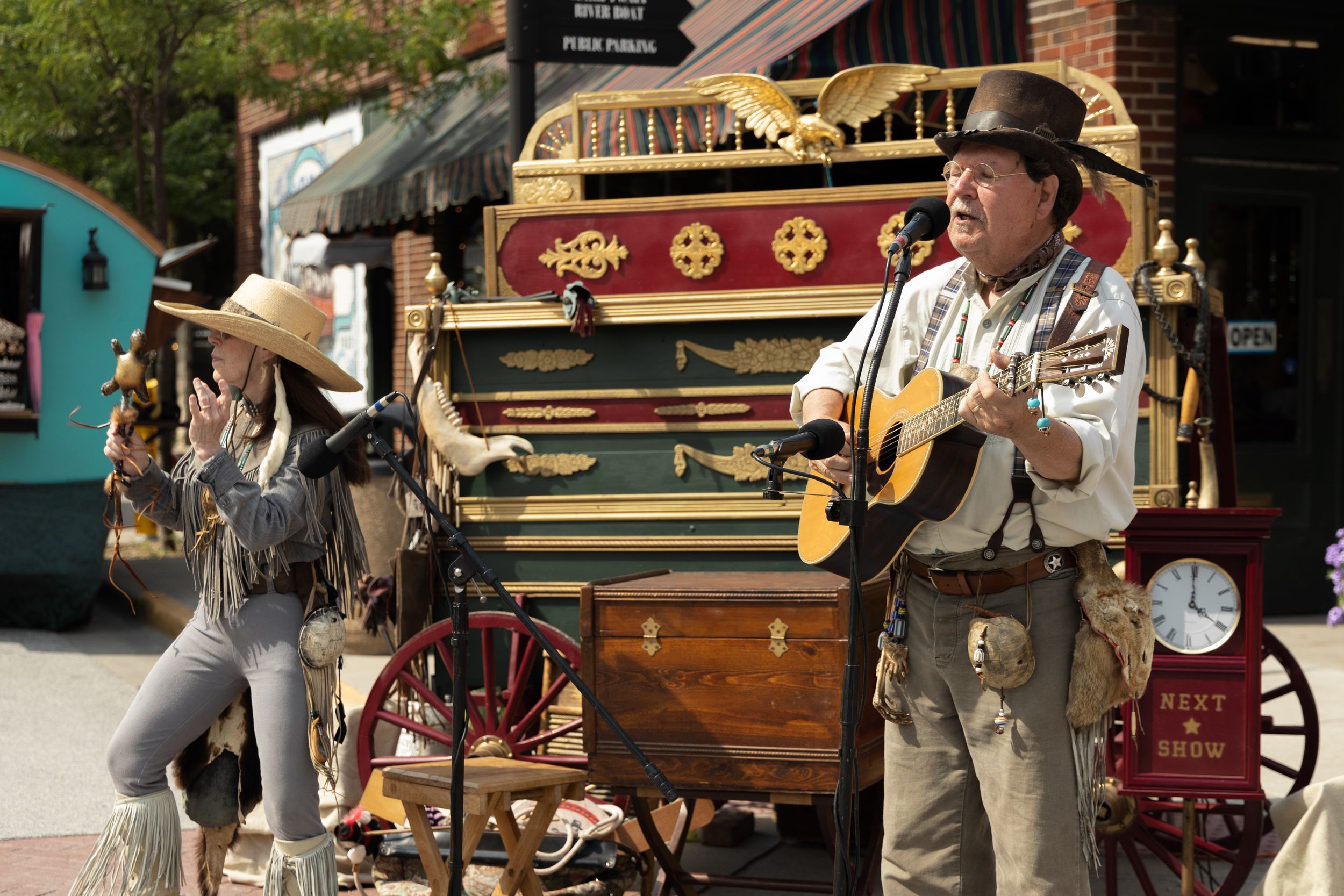 Event photo of a man and woman playing music at the Hannibal Twain on Main Festival in 2022