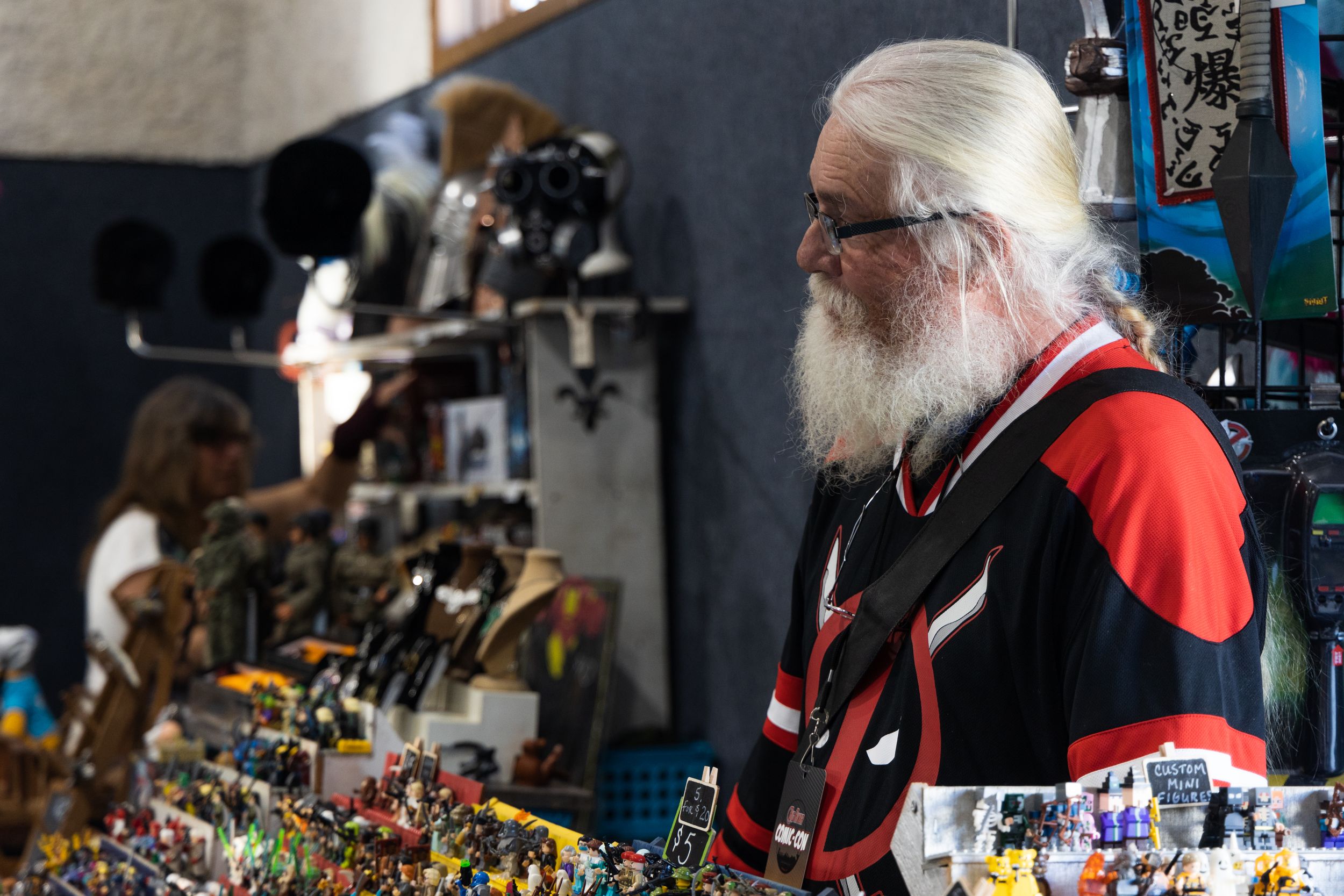 Event photo at Hannibal Big River Comic Convention of a man at his booth