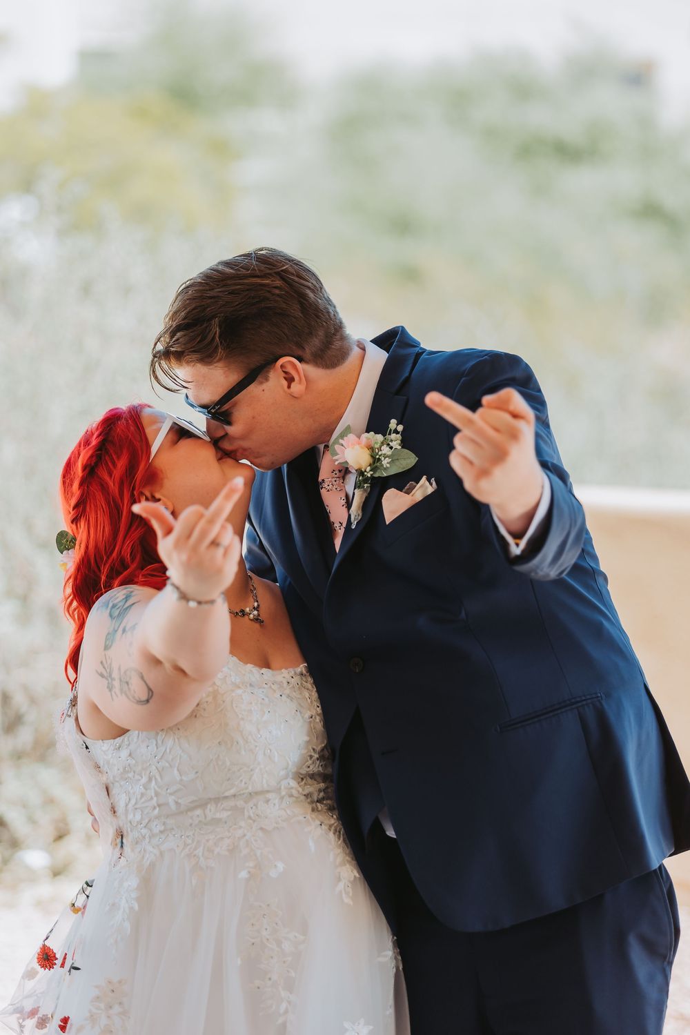 A romantic sequence of four wedding photos showing the couple sharing a loving kiss in their formal attire.