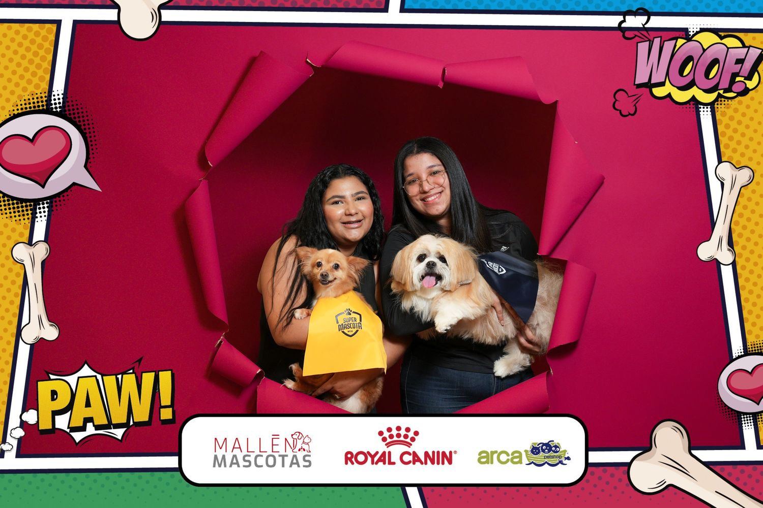 Photo booth frame with PAW! text showing two people and a small fluffy dog against a bright pink background.