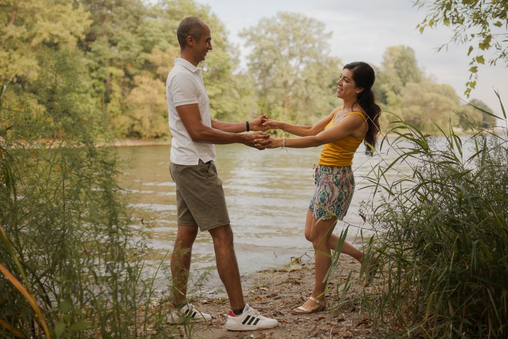 Couple playful on the shoreline of Lake Ontario. Kingston, On, Ca