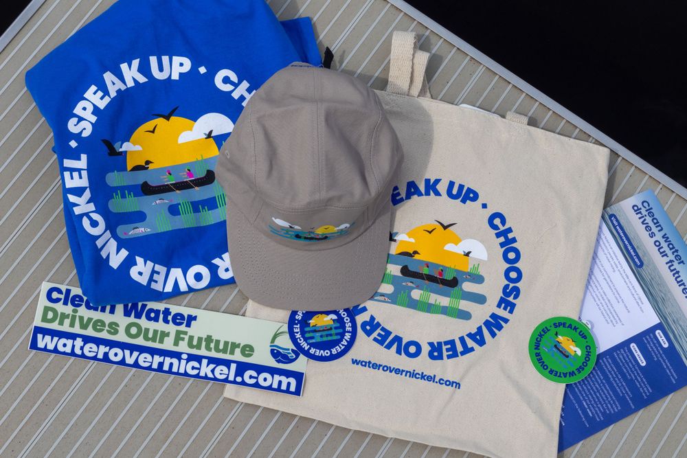 Promotional merchandise including hat and tote bags with Water Over Nickel branding.