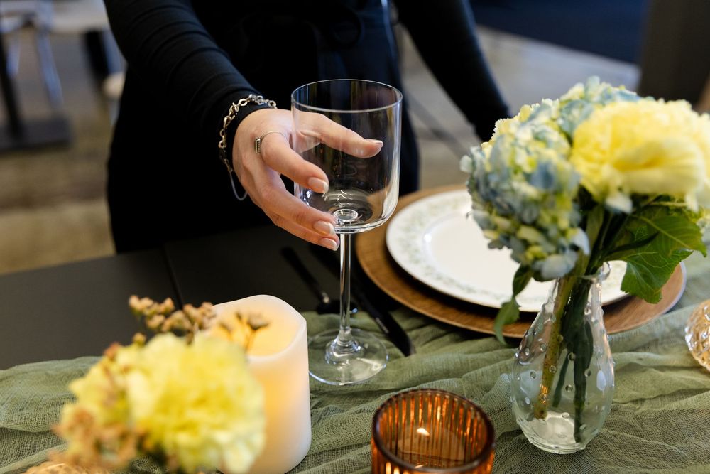 Wine glasses and elegant table settings create an intimate fine dining atmosphere at an upscale restaurant.