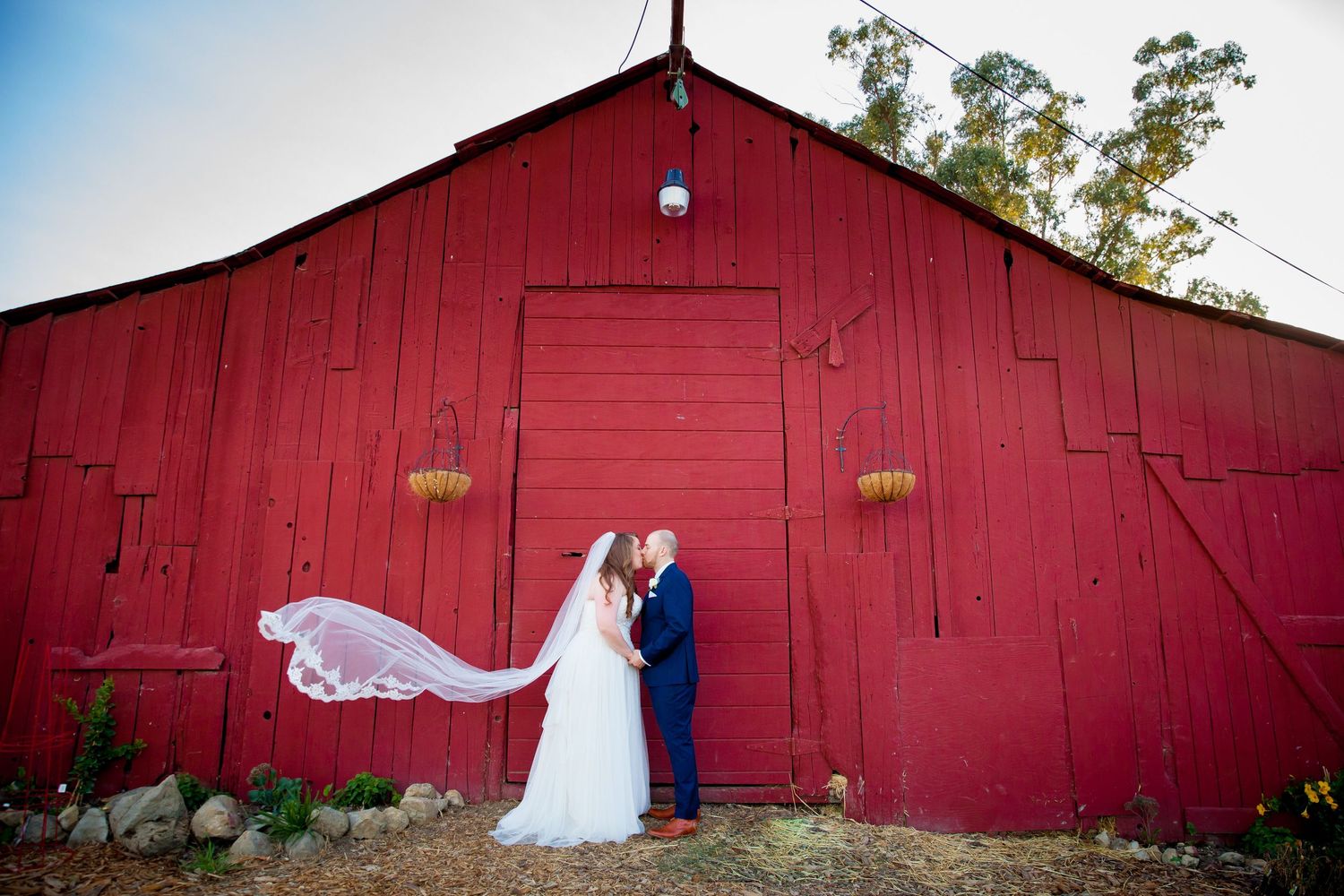 A romantic sunset wedding photo session overlooking a desert mountain landscape in Arizona.