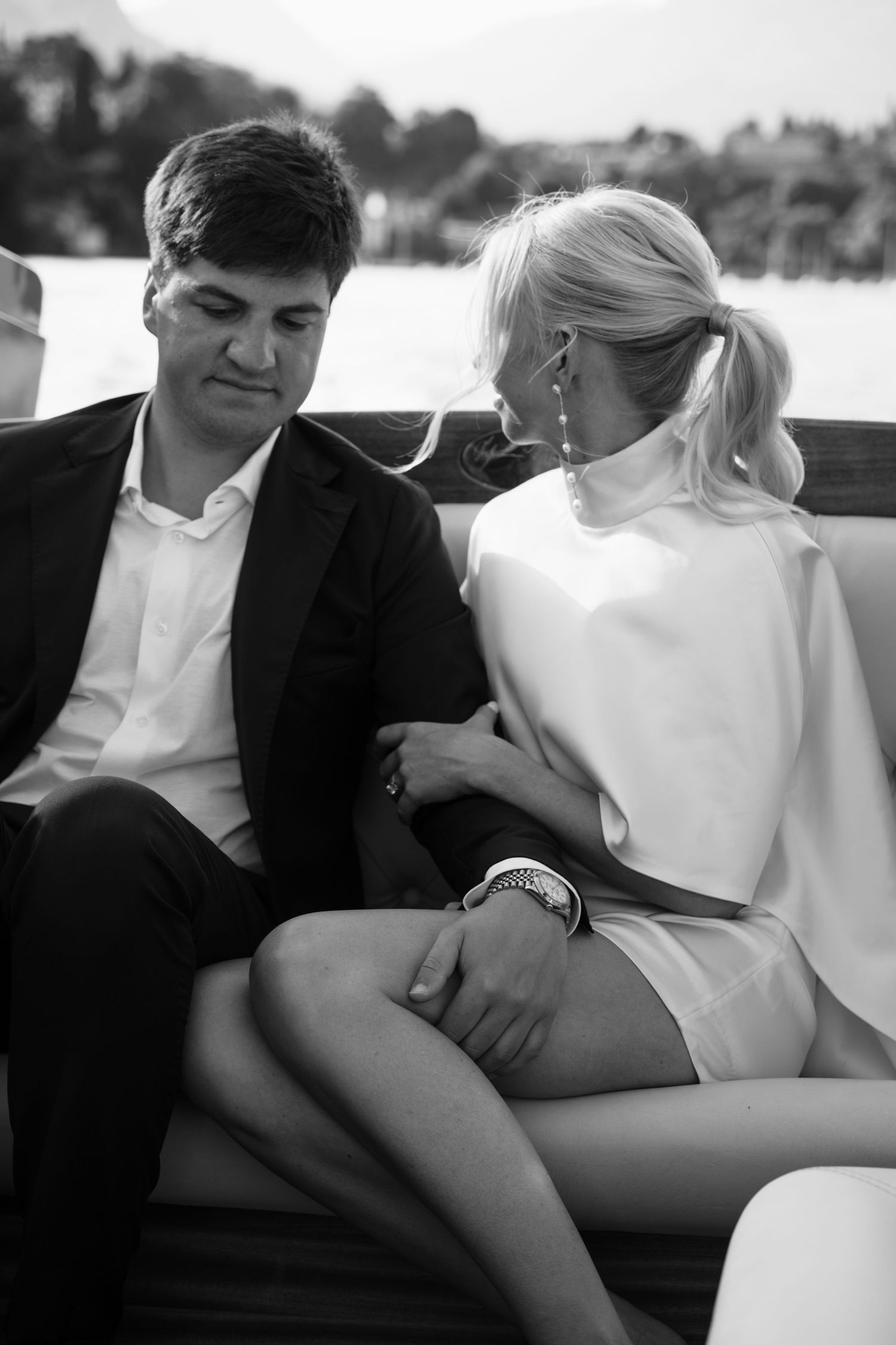 Black and white intimate romantic couple portrait series showing tender moments in a car.