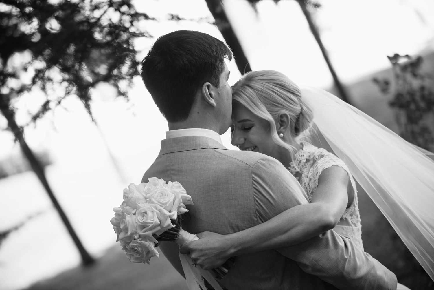 Black and white wedding photo montage showing romantic moments between a couple during their special day.