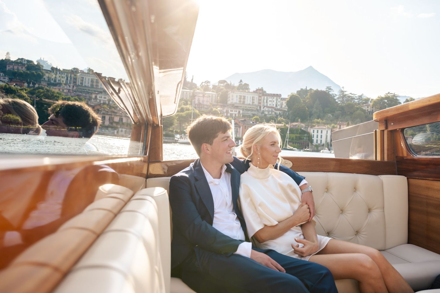 Couple enjoying a luxurious limousine ride while dressed in formal attire.