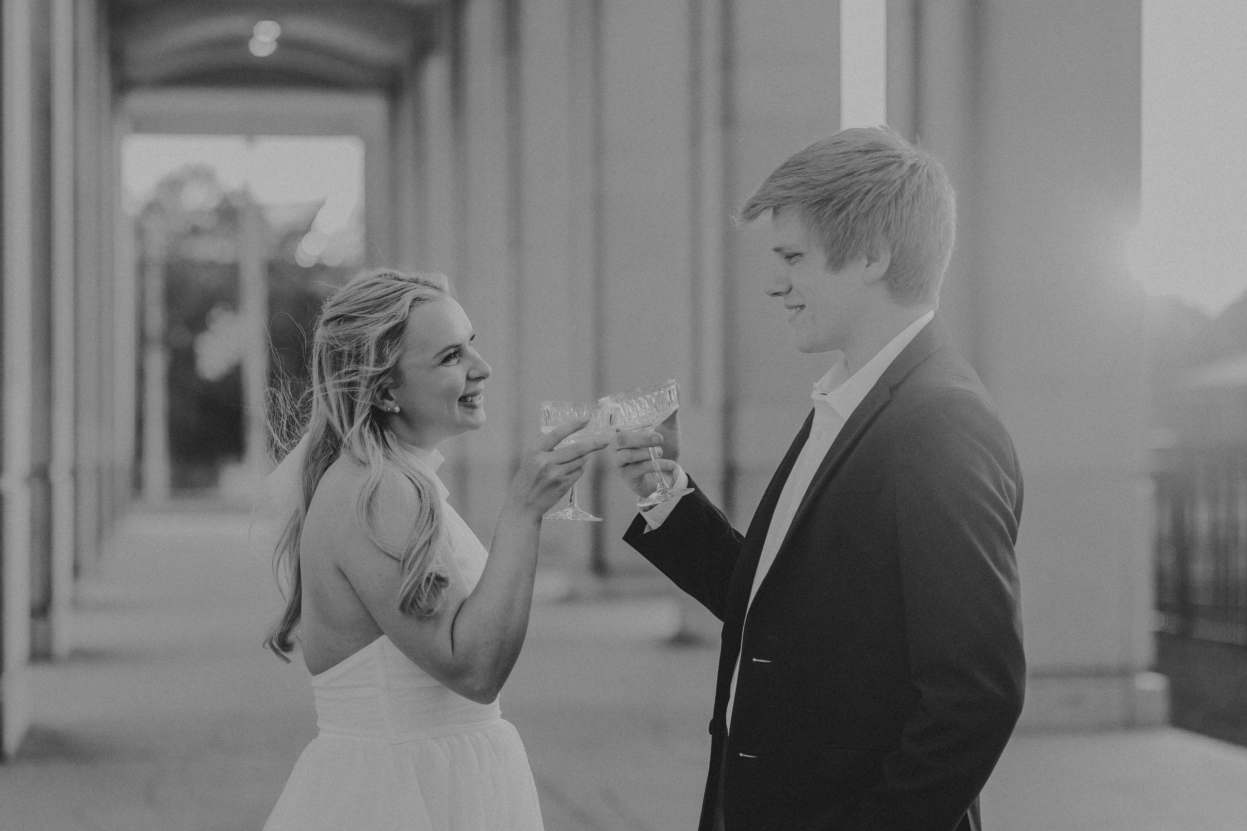 A series of romantic black and white wedding photos showing couples dancing and embracing at an elegant venue.
