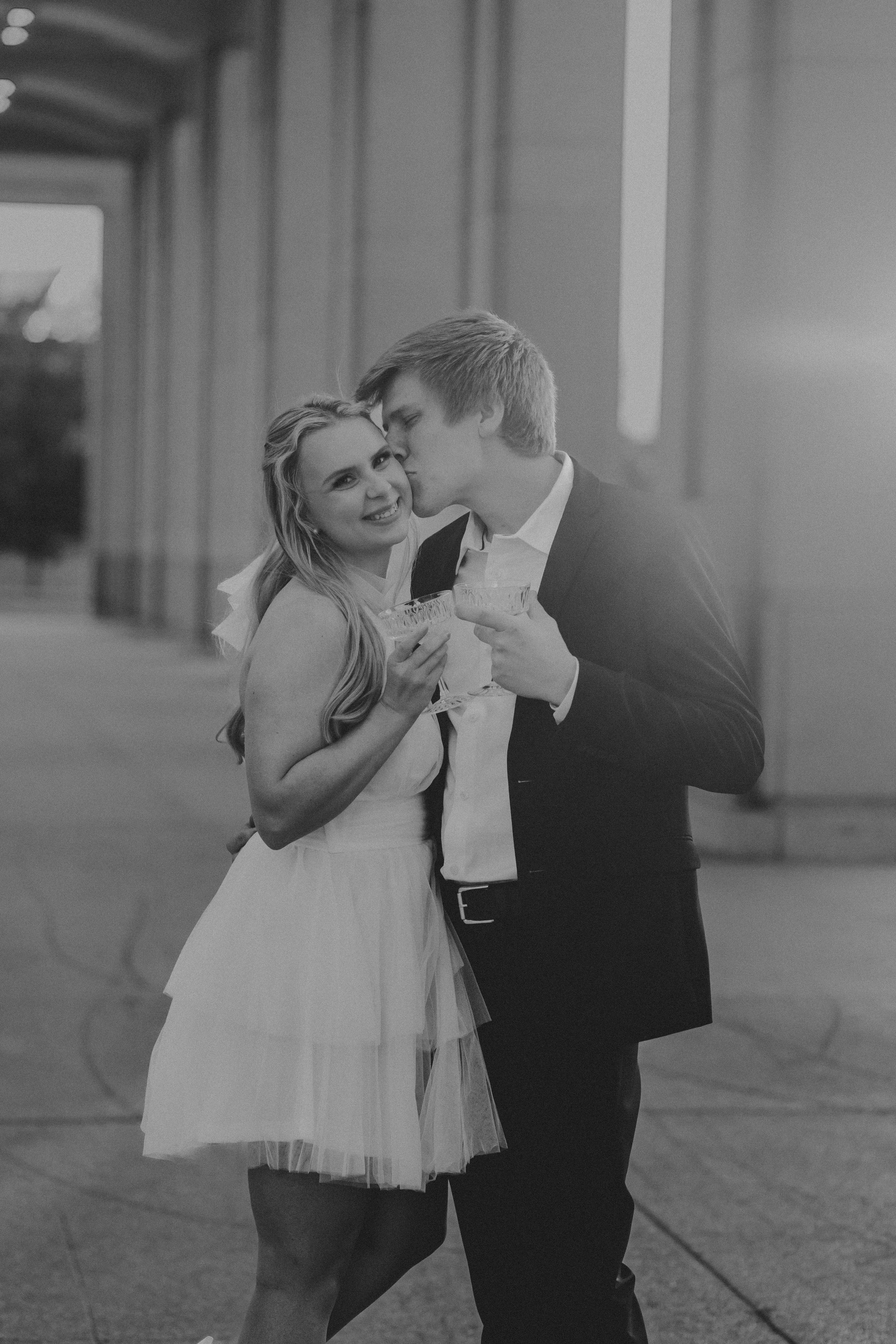 A couple in wedding attire share intimate moments in a series of black and white romantic photographs.