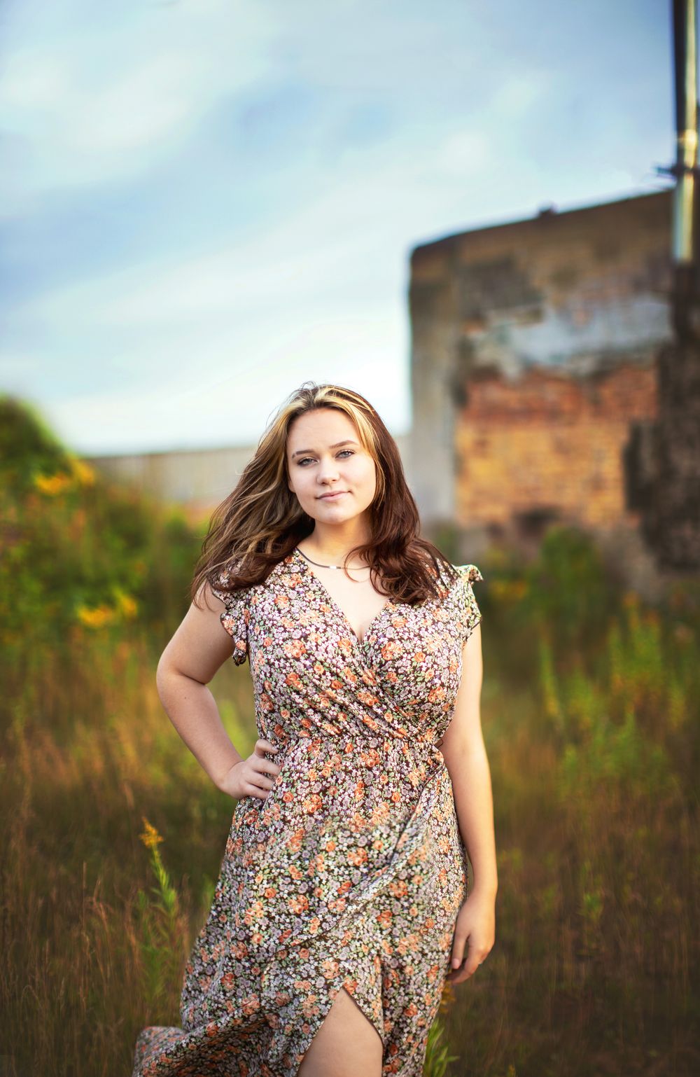 High school senior standing near brick buildings in downtown Duluth