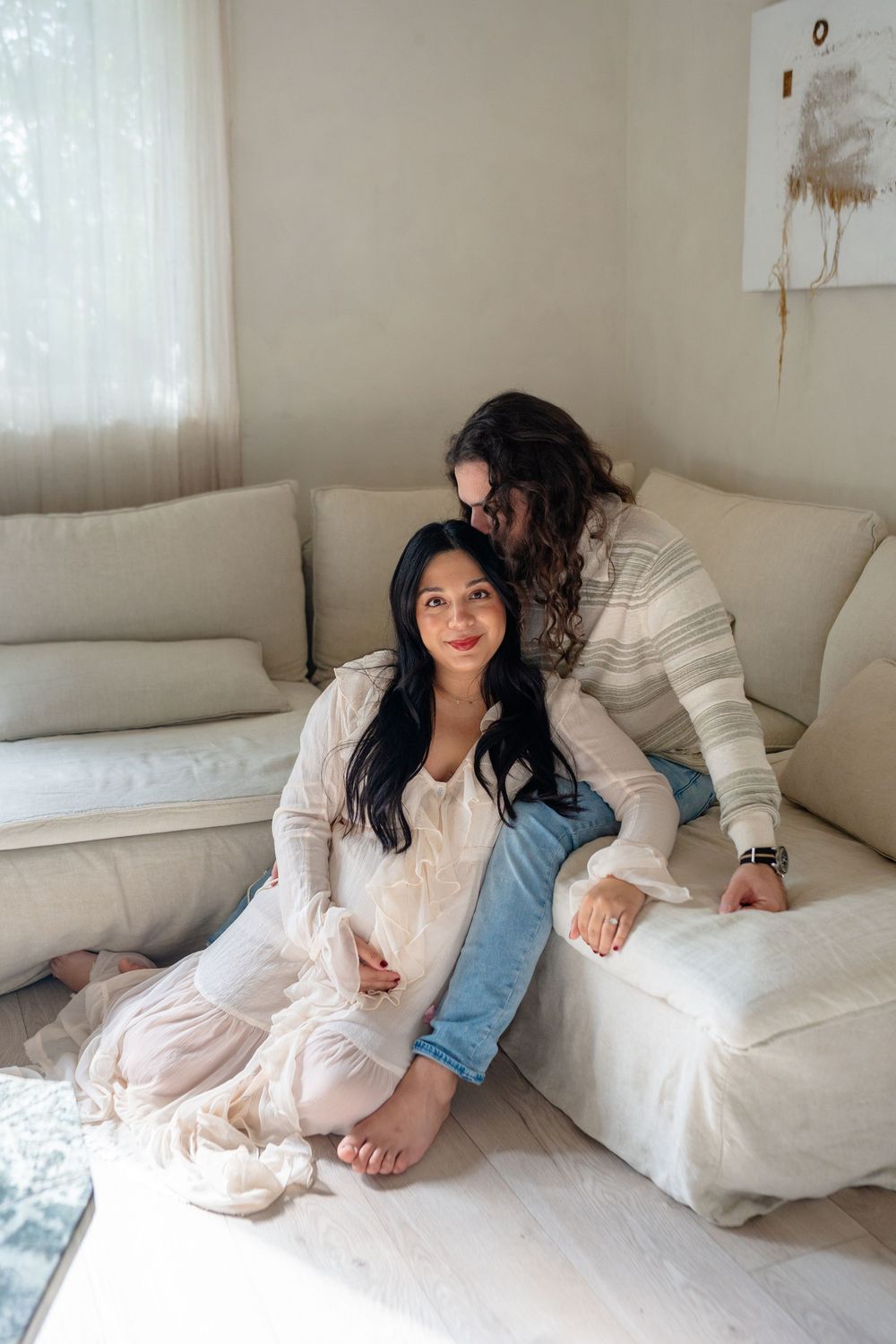 Candid sequence showing relaxed poses and joyful expressions on a comfortable white sofa.