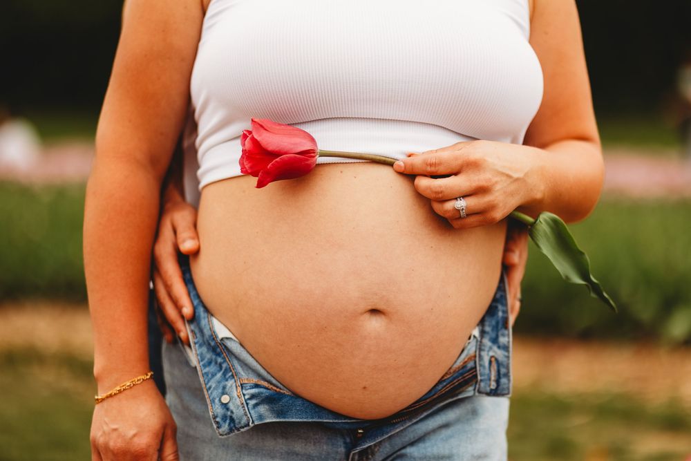 Maternity session taken in Belleville Michigan with the tulips.