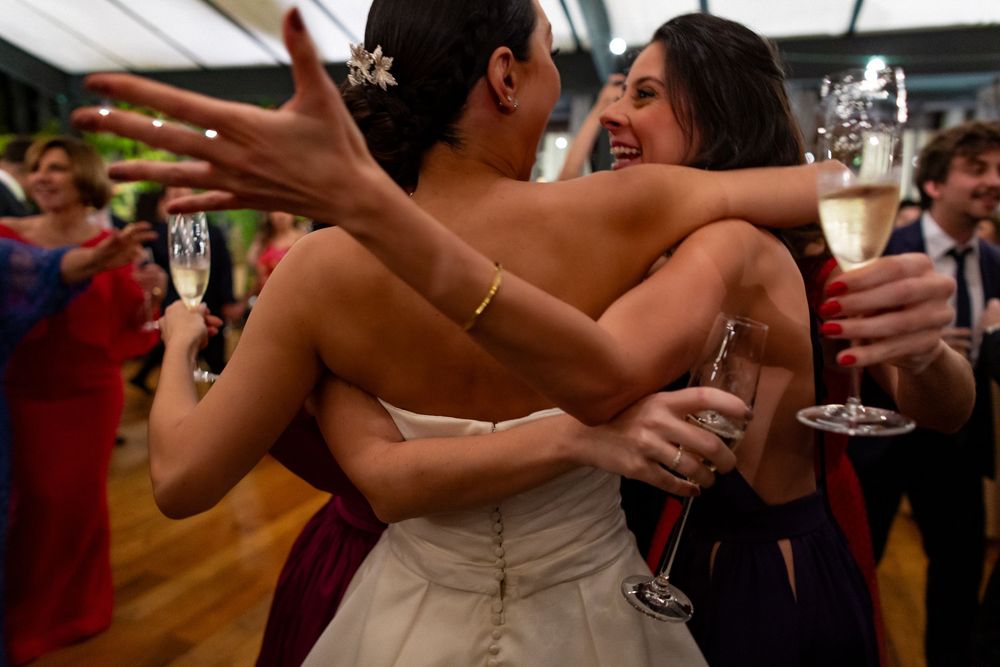 People celebrating and dancing together at a festive wedding reception party.