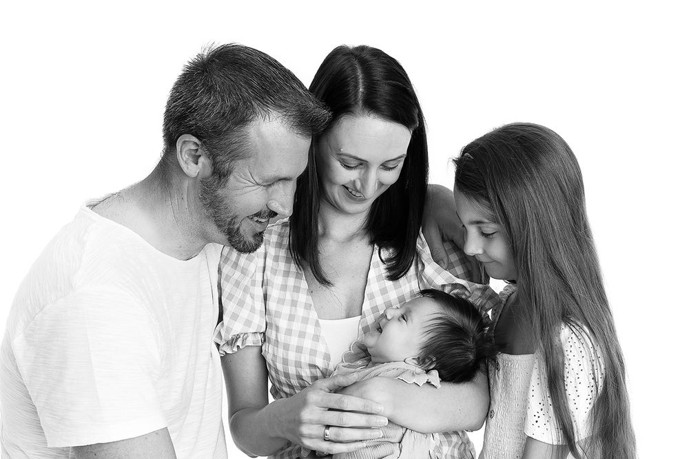 Newborn photograph with family and sister taken in a studio near Selby