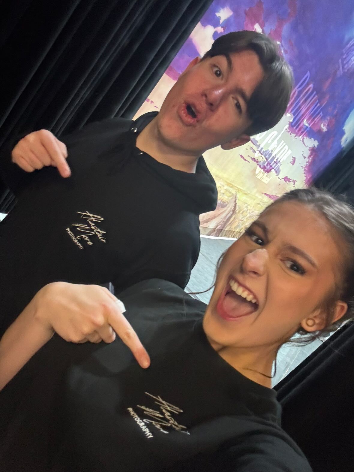 A series of selfies showing two people in black clothing making playful expressions and poses against a colorful background.