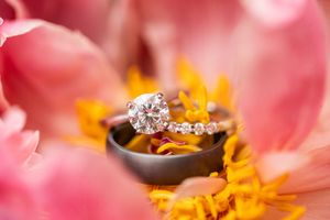Extreme macro photography of pink and orange flower petals with soft focus.