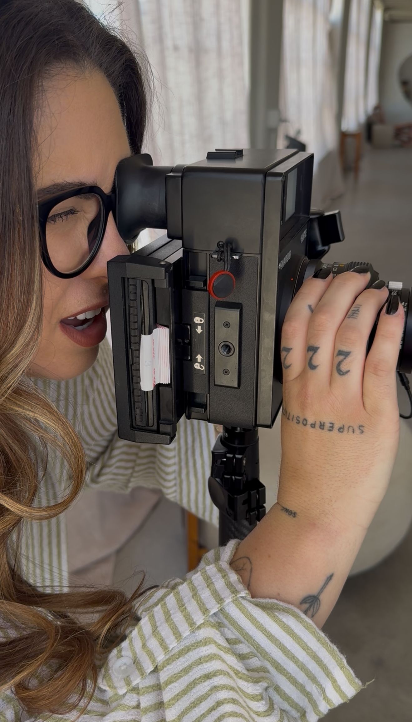 A series of self-portrait photographs showing someone taking pictures with various cameras in mirror reflections.