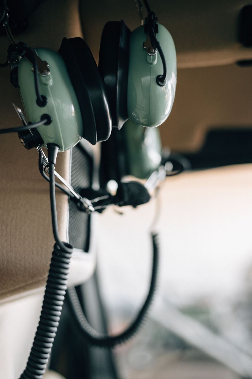 Close-up detail shots of aviation headsets and communication equipment in cockpit.