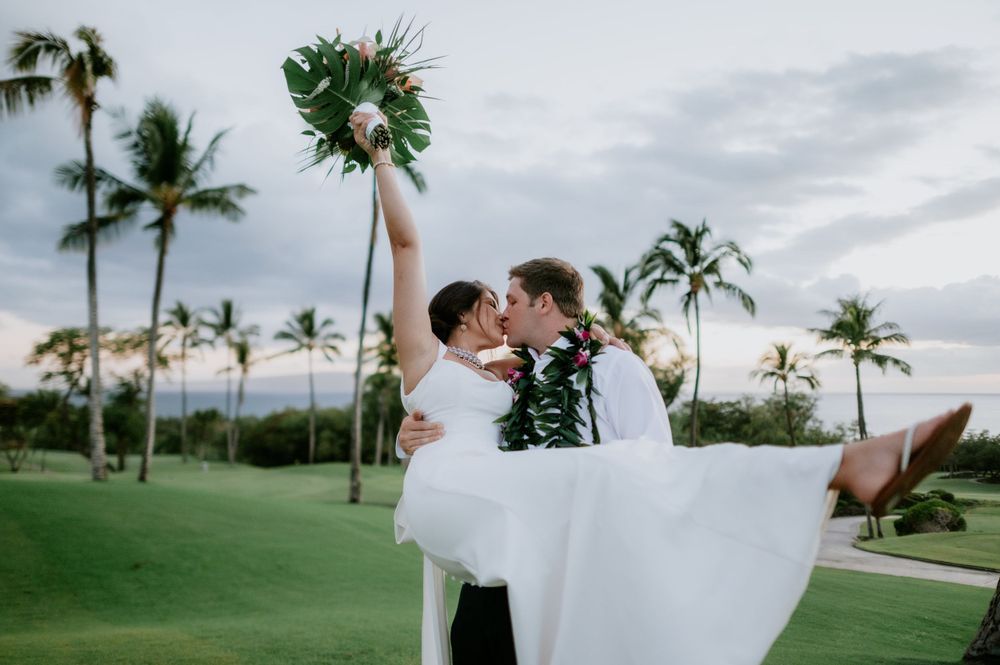 Romantic wedding photography on a tropical golf course with palm trees in the background.