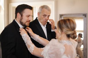 Wedding guests dance together in pairs during an elegant ballroom reception celebration.