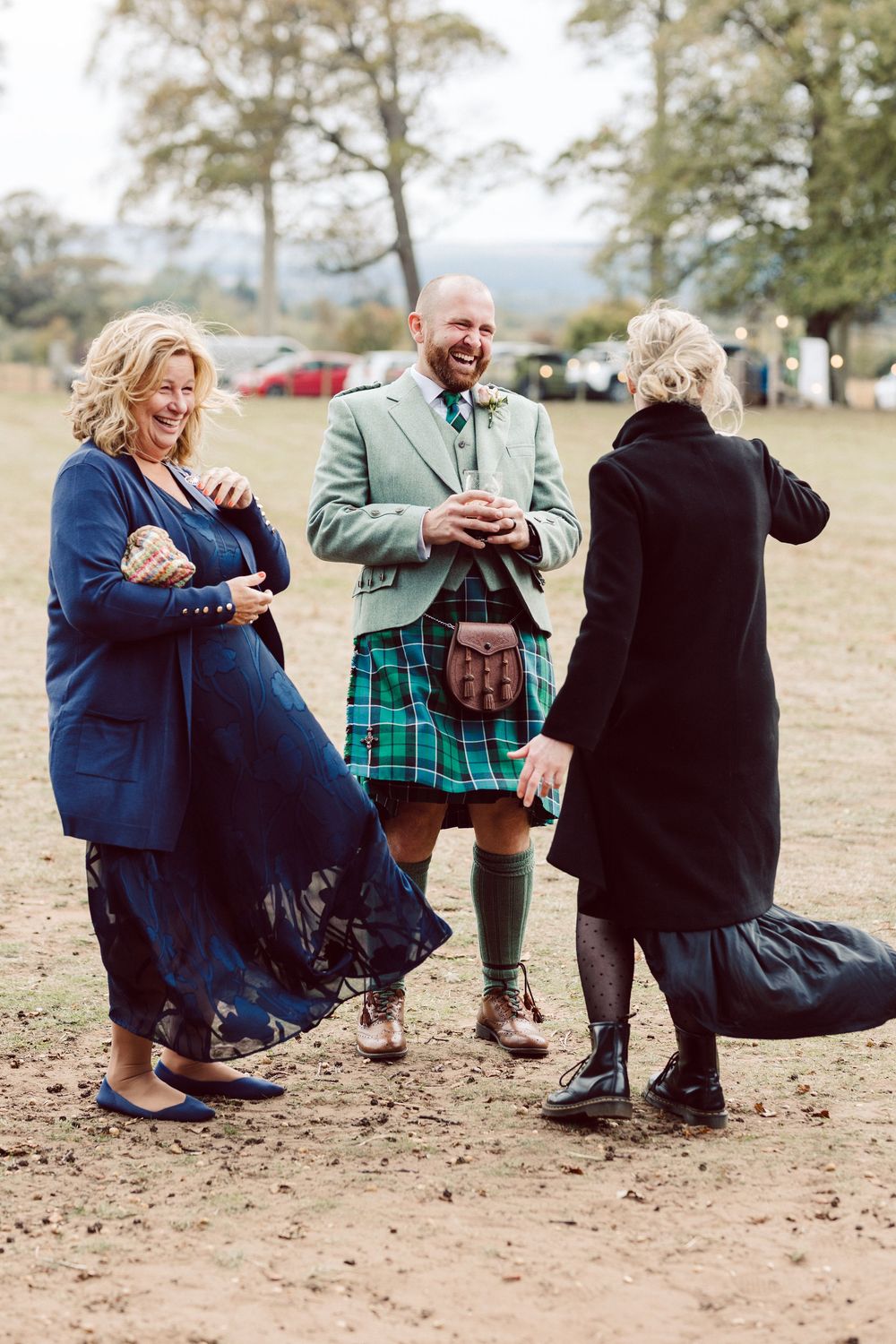 A sequence of photos showing people dancing together in an outdoor setting on dusty ground.
