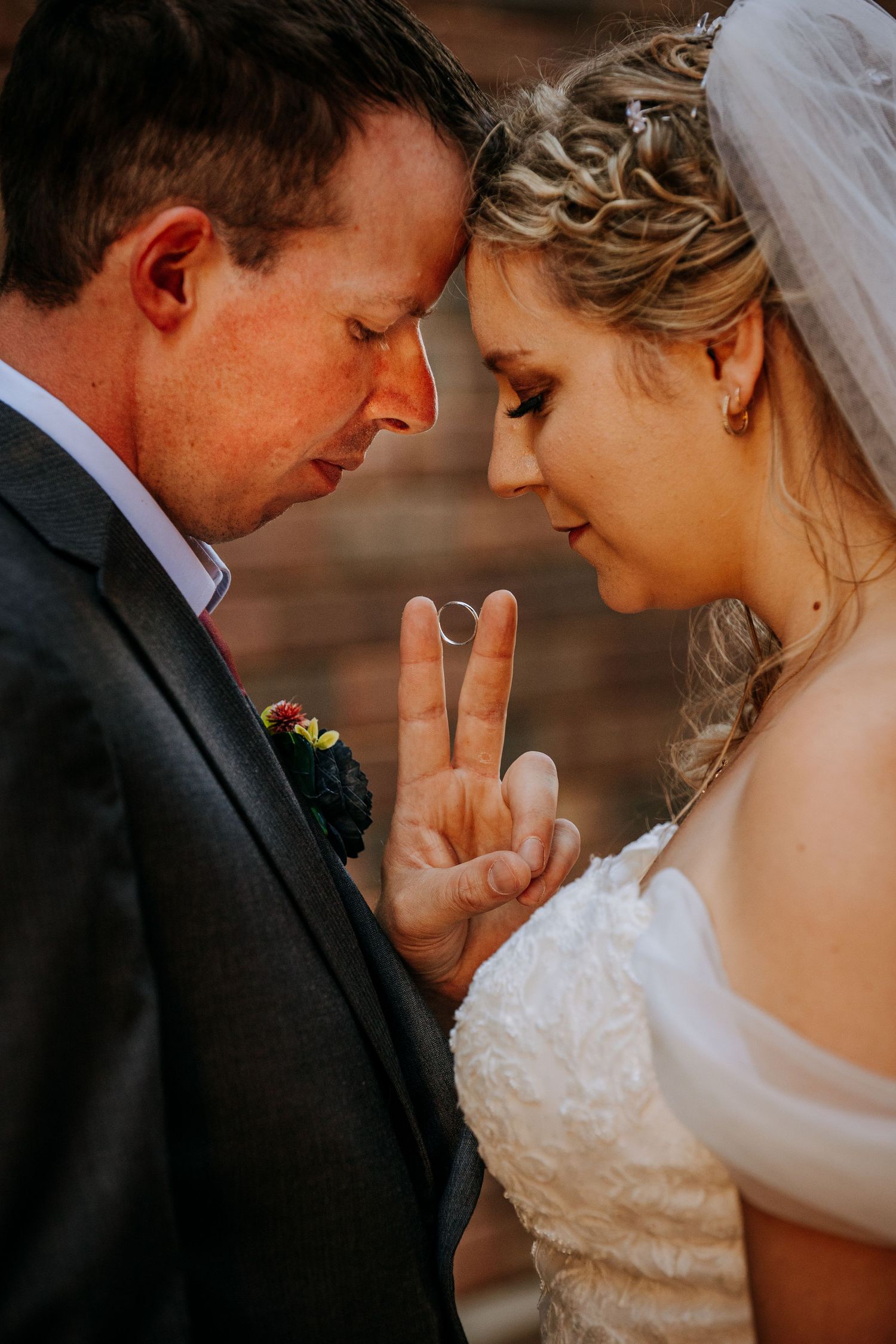 A romantic wedding photo series showing tender moments between newlyweds in black and white tones.