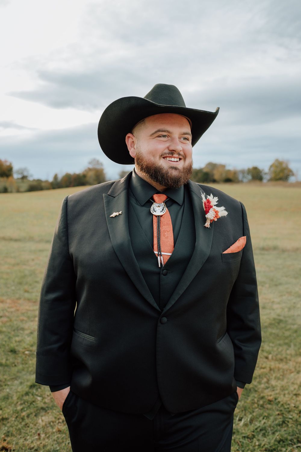 Groom celebrating western-themed wedding at rustic barn in Tennessee