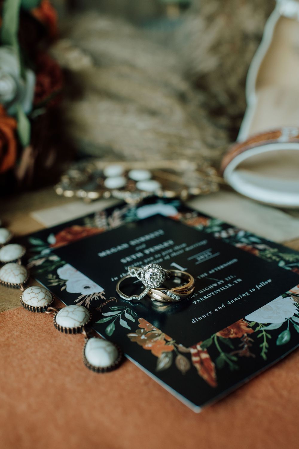 Wedding rings on rustic barn wood, western-themed November wedding in Tennessee