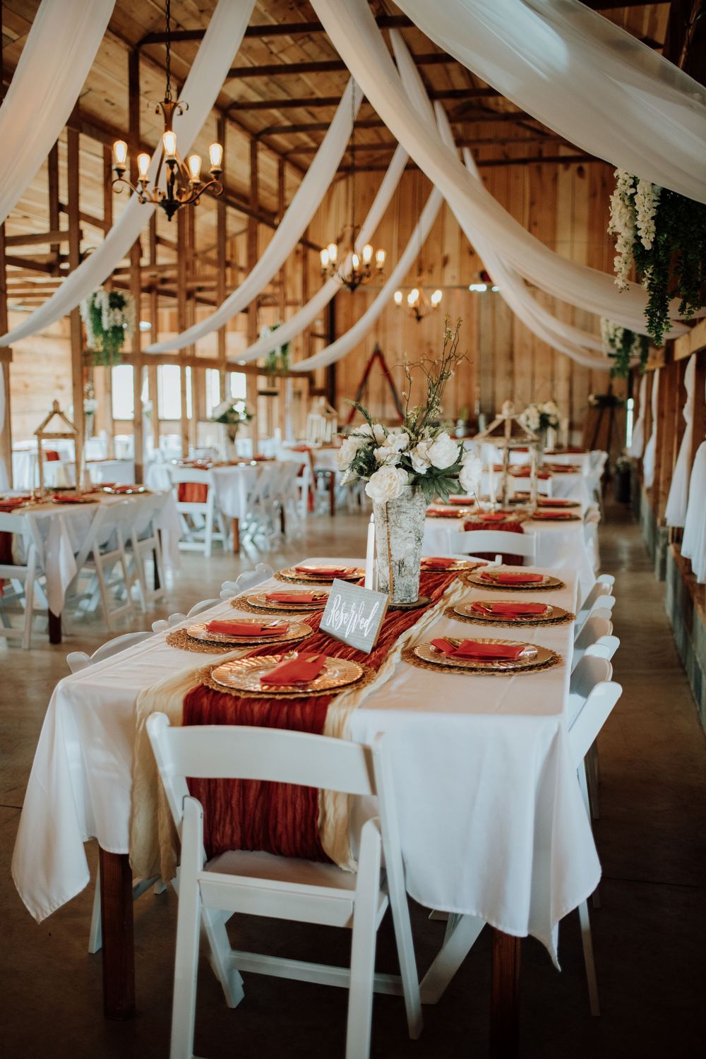 Couple celebrating western-themed wedding at rustic barn in Tennessee