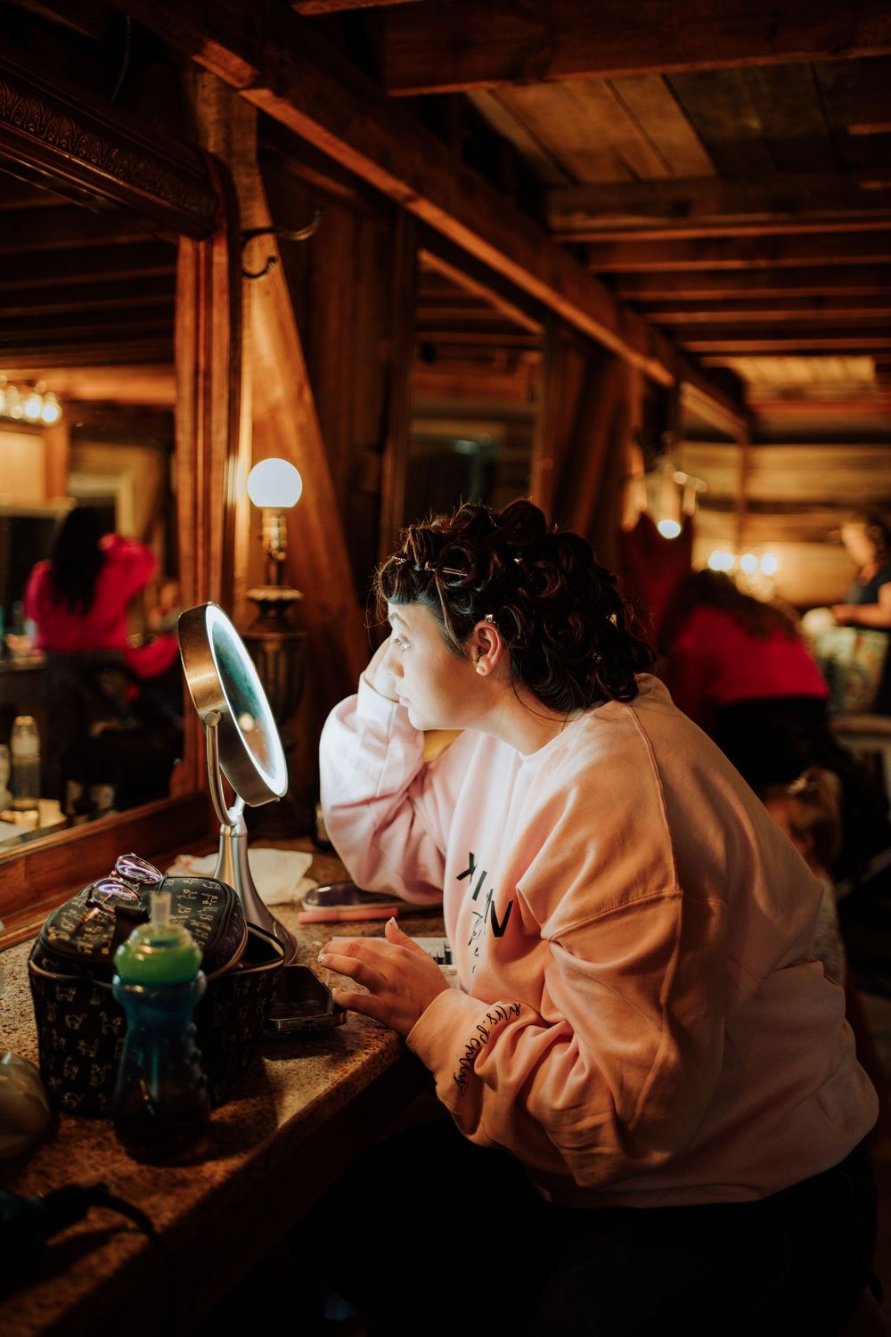 Bride getting ready for western-themed wedding at rustic barn in Tennessee